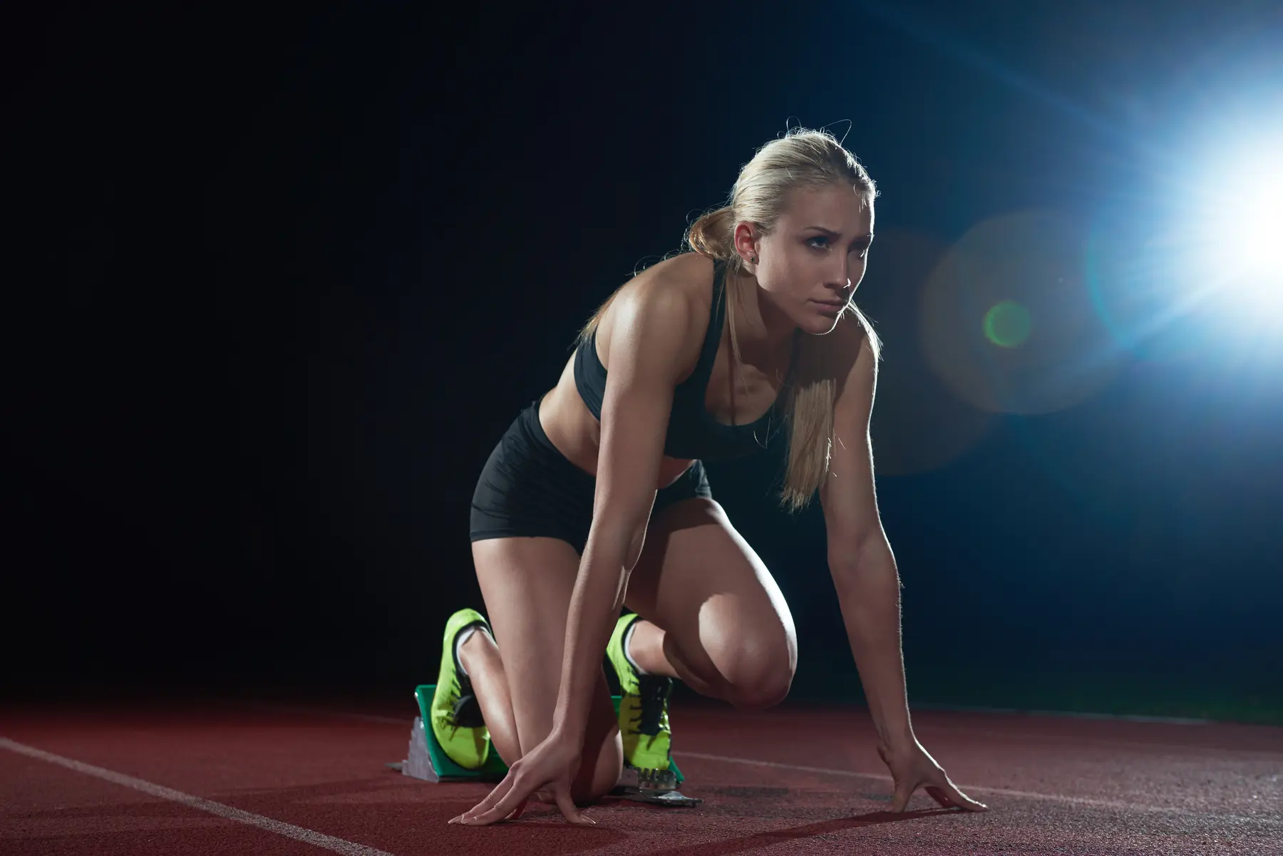 Sprinter set in the blocks at the start of a race